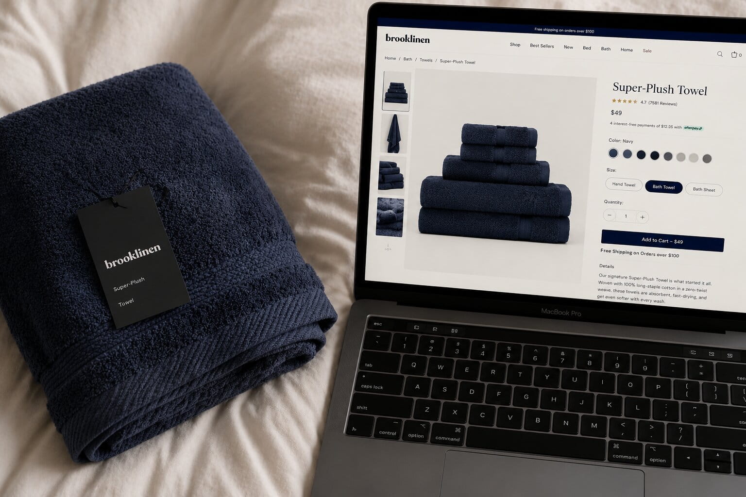Flatlay of towel next to laptop showing product page